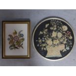 A framed and glazed antique hand embroidered picture of a vase of flowers along with a framed and