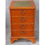 A Georgian style yew filing cabinet with inset leather top above two deep drawers on bracket feet.