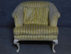 A Tomlinson fully upholstered armchair on Queen Anne style supports. H.75cm