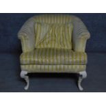 A Tomlinson fully upholstered armchair on Queen Anne style supports. H.75cm