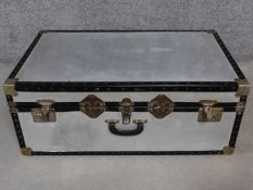 A contemporary aluminium traveling trunk. H.33 W.84 D.51cm