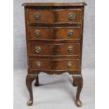 A Georgian style flame mahogany chest of four drawers on cabriole supports. H.74 W.41 D.36cm