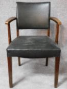 A vintage oak armchair in faux leather on square supports. H.85cm