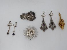 A collection of costume jewellery. Including a cultured pearl and silver floral design brooch, a