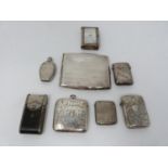 A collection of antique silver and metal vesta cases and a silver cigarette case. Including an