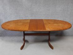A vintage teak G-plan dining table on stretchered outswept supports. H.72 L.210 W.107cm