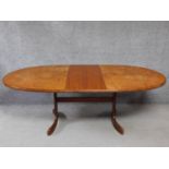 A vintage teak G-plan dining table on stretchered outswept supports. H.72 L.210 W.107cm