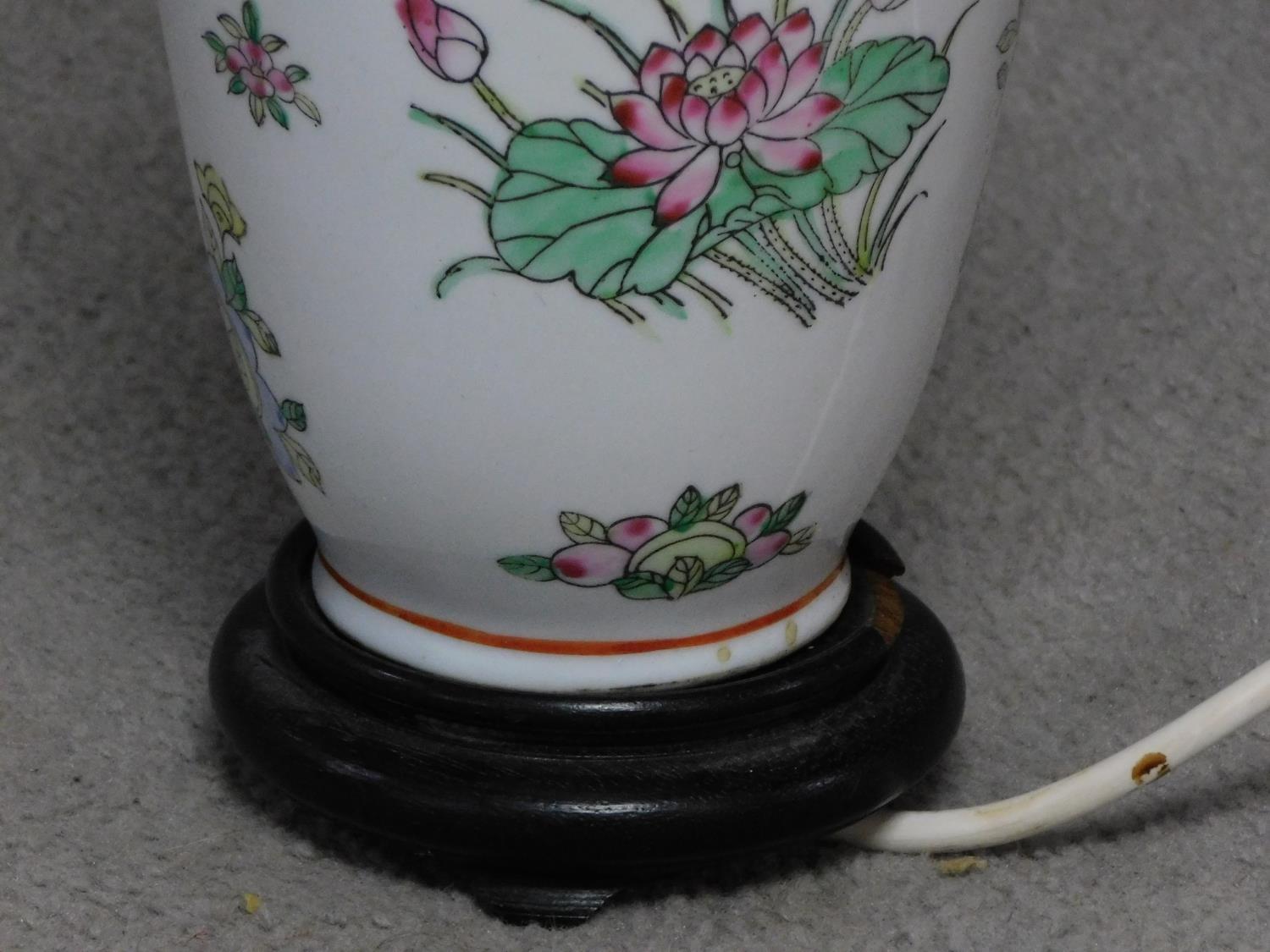 A vintage hand painted porcelain Chinese vase lamp base on carved hard wood stand. With floral and - Image 4 of 4