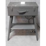 A military style bedside table from an old case wired as a charging station. H.80 L.60 W.40cm