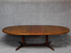 A 1970's vintage rosewood extending dining table. (Includes one leaf) H.71 L.246 W.109cm (fully