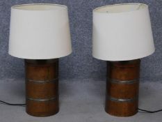 A pair of vintage style beaten copper table lamps. H.61cm