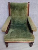 A late Victorian mahogany velvet upholstered armchair raised on turned tapering supports. H.94cm