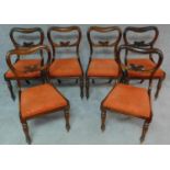 A set of six Victorian rosewood kidney shaped back dining chairs with drop in seats on carved