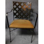 A metal framed conservatory armchair with lattice work back. H.91cm
