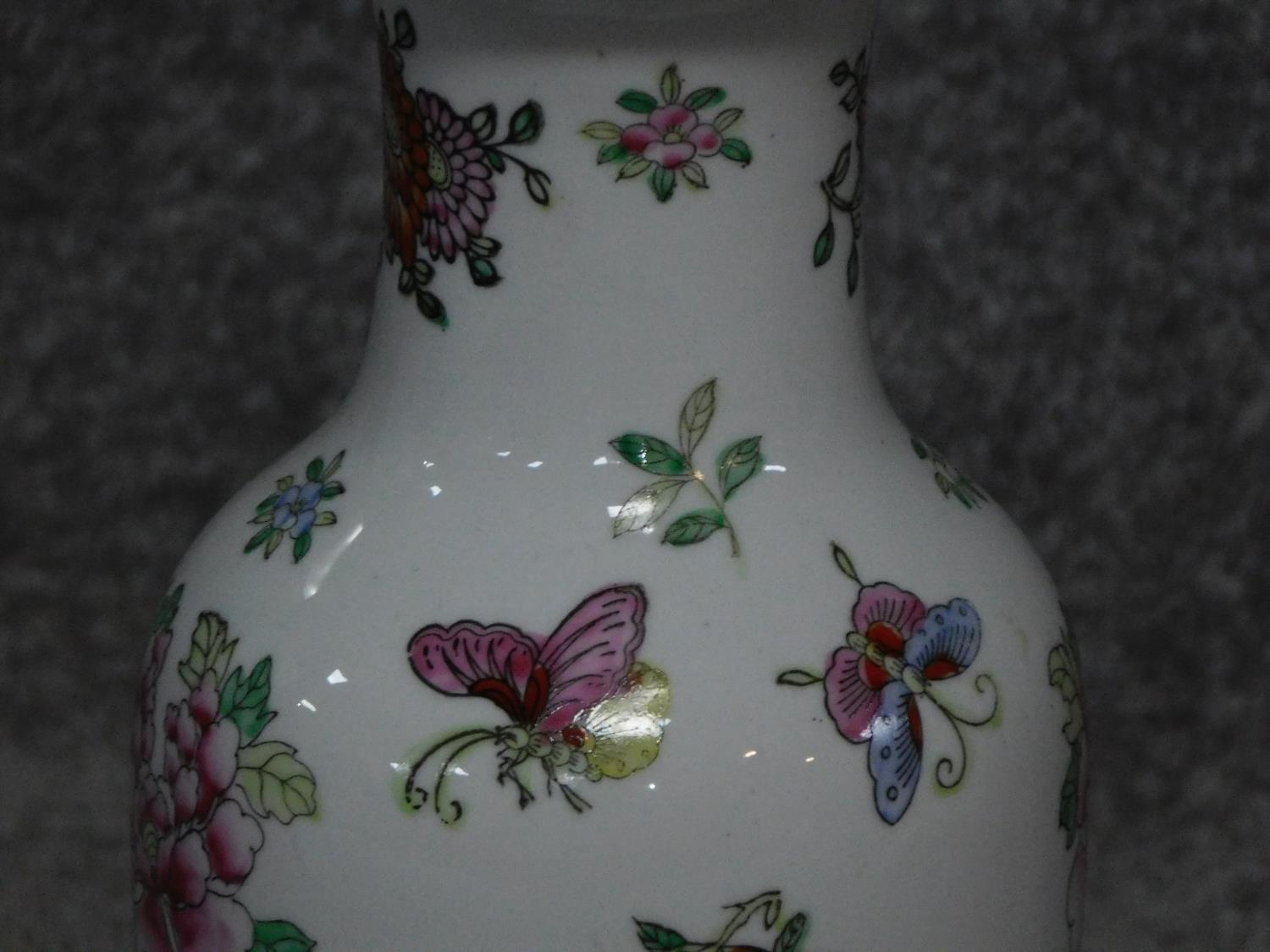 A vintage hand painted porcelain Chinese vase lamp base on carved hard wood stand. With floral and - Image 2 of 4
