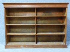 A 20th century walnut open bookcase on plinth base. H.124 W.177 D.42cm