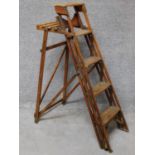 An vintage library step ladder with platform support. H.122cm