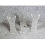 Four handcut crystal vases. A matching pair with star design, a large star cut vase and a smaller