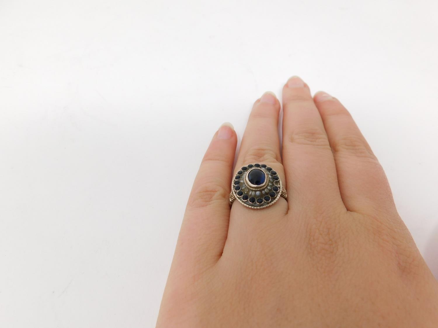 An antique Austrian silver, blue stone and seed pearl cluster ring. Set to centre with an oval - Image 5 of 15