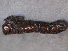 An African hardwood carving of a herd of elephants. 120x36cm