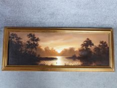 A gilt framed oil on canvas of a river sunset landscape by british artist Keith English. Signed by