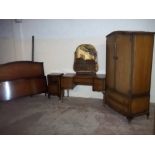 A REPRODUCTION BEDROOM SUITE COMPRISING A WARDROBE, DRESSING TABLE, BEDSIDE CABINET AND BED FRAME (
