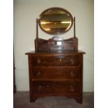 AN OAK DRESSING TABLE