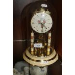 A HALLER GLASS DOMED MANTEL CLOCK