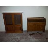 A LOW OAK UNIT TOGETHER WITH A DISPLAY CABINET