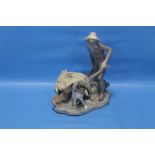 A LLADRO FIGURE OF BOY WITH DOG