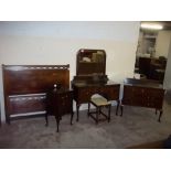 A MAHOGANY DRESSING TABLE, THREE DRAWER CHEST, BEDSIDE CABINET + A STOOL (5)