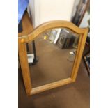 AN OAK FRAMED MIRROR 85 X 65 CM