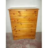 A HONEY PINE FIVE DRAWER CHEST