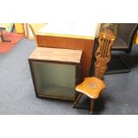 A DISPLAY CABINET AND A SPINNING CHAIR