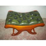 A LEATHER TOPPED STOOL