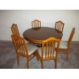 AN OAK DINING TABLE + SIX CHAIRS