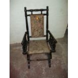A CHILDS ROCKING CHAIR