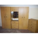 A MODERN TRIPLE WARDROBE WITH MATCHING CHEST OF DRAWERS