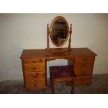 A HONEY PINE DRESSING TABLE WITH MIRROR