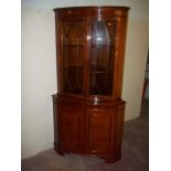 A DOUBLE CORNER CABINET