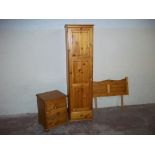 A HONEY PINE SINGLE WARDROBE + A BEDSIDE CABINET AND BEDHEAD
