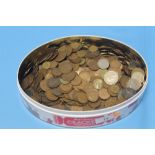 A TIN OF ASSORTED COINAGE