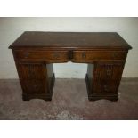 AN OAK LINENFOLD DRESSING TABLE / DESK