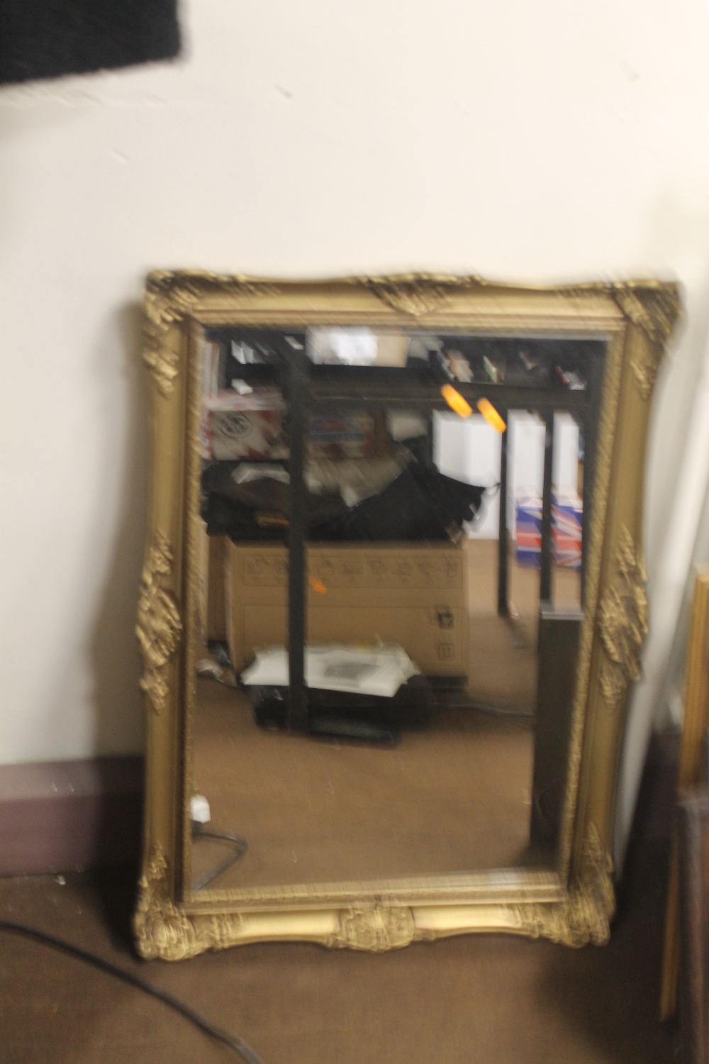 A GILT FRAMED MIRROR 80 X 58 CM