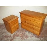 A HONEY PINE FOUR DRAWER CHEST AND A BEDSIDE CABINET