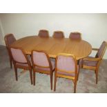 A TEAK DINING ROOM TABLE 180 X 102 CM TOGETHER WITH A SET OF EIGHT PARKER KNOLL CHAIRS