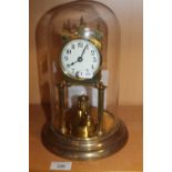 A GLASS DOMED 400 DAY BRASS ANNIVERSARY MANTEL CLOCK