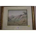 A FRAMED AND GLAZED WATERCOLOUR OF A COUNTRY HILLSIDE SCENE SIGNED A G COLE