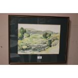 A FRAMED AND GLAZED WATERCOLOUR OF A RURAL RIVER SCENE