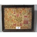 AN ANTIQUE FRAMED AND GLAZED CROSS STITCH